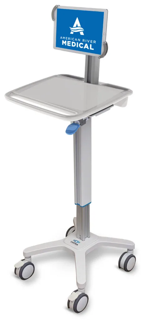 Medical tablet cart with blue display screen and white base on wheeled casters